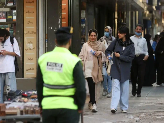 Iranian women walk on a street during the revival of morality police in Tehran, Iran, July 16, 2023.