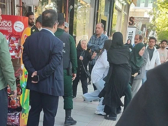 Hijab enforcers trying to arrest a woman over hijab violation in Tehran on April 13, 2024