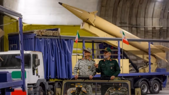 Iran unveils underground missile site under shadow of US threats