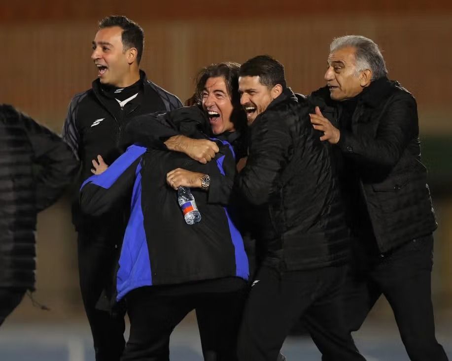 Coaches of Esteghlal F.C. react after a goal was disallowed against Tractor S.C. on January 18, 2026.