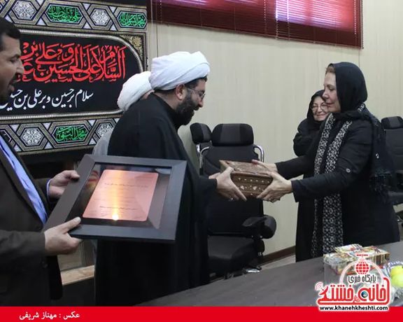 Fatemeh Amin in Tehran being honored by regime officials. Undated