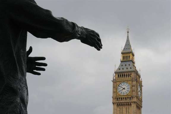 The Big Ben clock tower is pictured behind a sculpture in London, UK, File Photo.