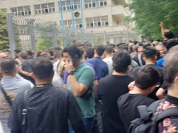 Cosmetics retailors demonstrate outside the National Tax Administration building in Tehran on May 13, 2024.