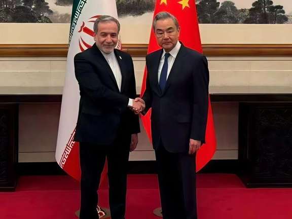 Iran's Foreign Minister Abbas Araghchi is greeted by Chinese counterpart Wang Yi, in Beijing, May 6, 2026