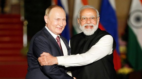 Russia's President Vladimir Putin shakes hands with India's Prime Minister Narendra Modi ahead of their meeting at Hyderabad House in New Delhi, India, December 6, 2021.