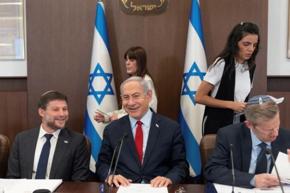 Israeli Prime Minister Benjamin Netanyahu, centre, and Finance Minister Bezalel Smotrich, left, attend a weekly cabinet meeting in the prime minister's office in Jerusalem, June 18, 2023.