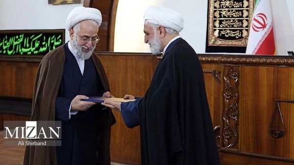 Iran's Chief Justice Gholamreza Mohseni-Ejei (right) appointed Mohammad Movahedi-Azad as the country’s new prosecutor general during a ceremony in Tehran on August 6, 2023.