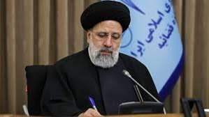 Iran's President Ebrahim Raisi taking notes during a meeting on August 1, 2022