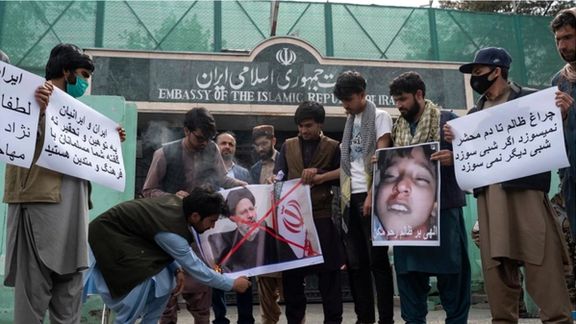 Afghans protesting outside Iran's embassy in Kabul. April 11, 2022
