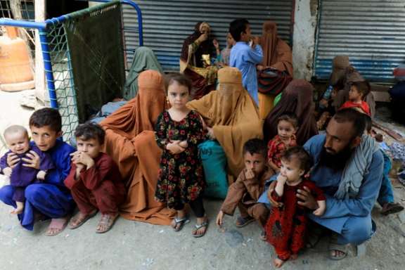 An Afghan family waiting to cross main Afghanistan-Pakistan land border crossing, in Torkham, Pakistan September 15, 2023