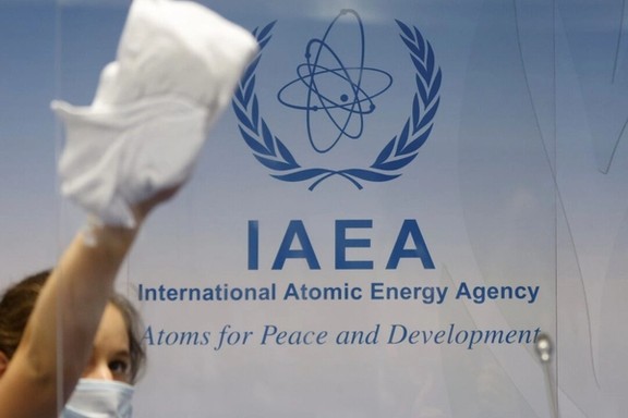 Cleaning staff works before a news conference attended by IAEA Director General Rafael Grossi during an IAEA Board of Governors meeting in Vienna, Austria, September 13, 2021.