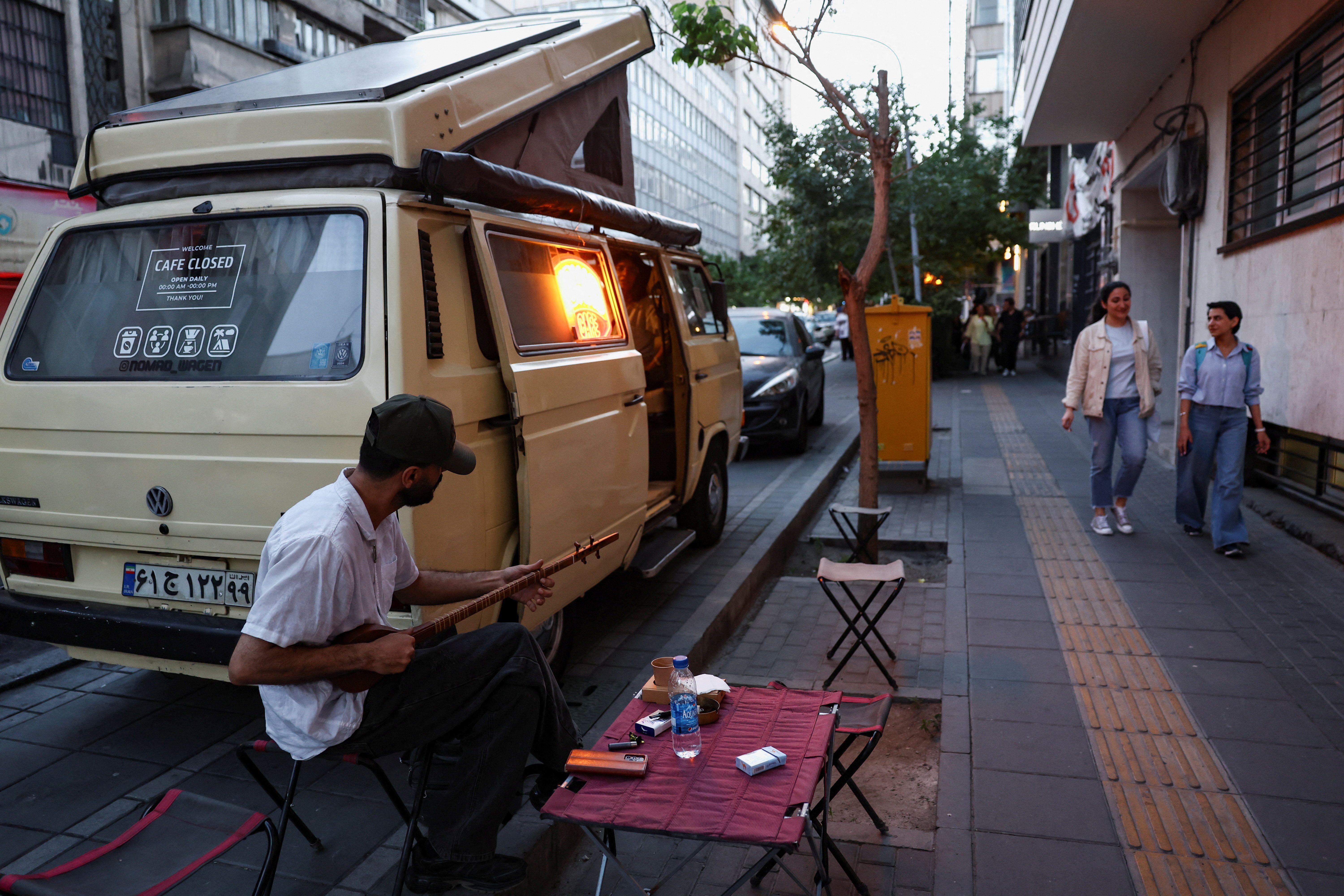 A street musician plays in a street in Tehran, Iran, May 10, 2026.