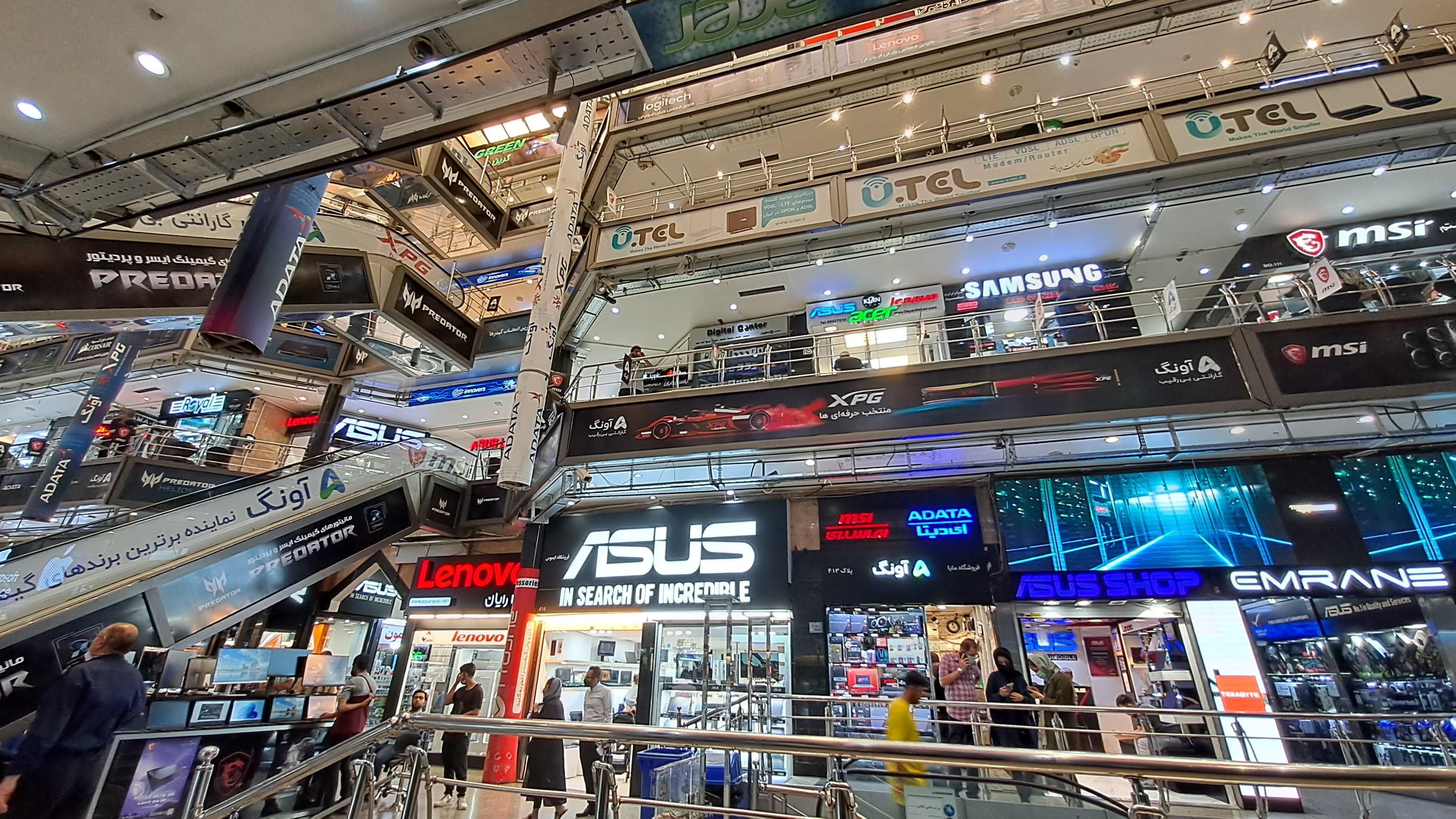 File photo of shoppers visiting a computer and electronics market in Iran, where stores sell laptops, gaming equipment and digital devices.