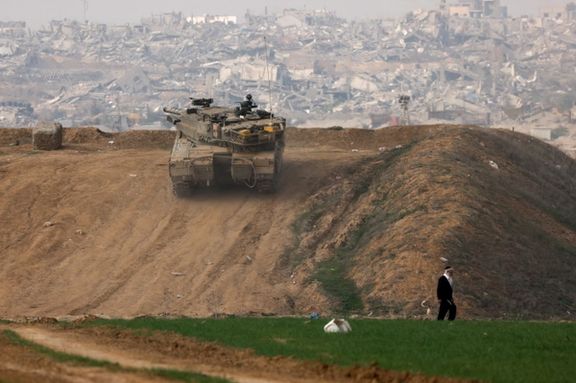 An Israeli tank manoeuvres near the Israel-Gaza border in southern Israel, December 27, 2023.