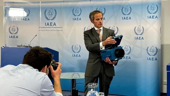 International Atomic Energy Agency Director General Rafael Grossi presents a surveillance camera at the agency's headquarters during a news conference in Vienna, Austria, December 17, 2021.