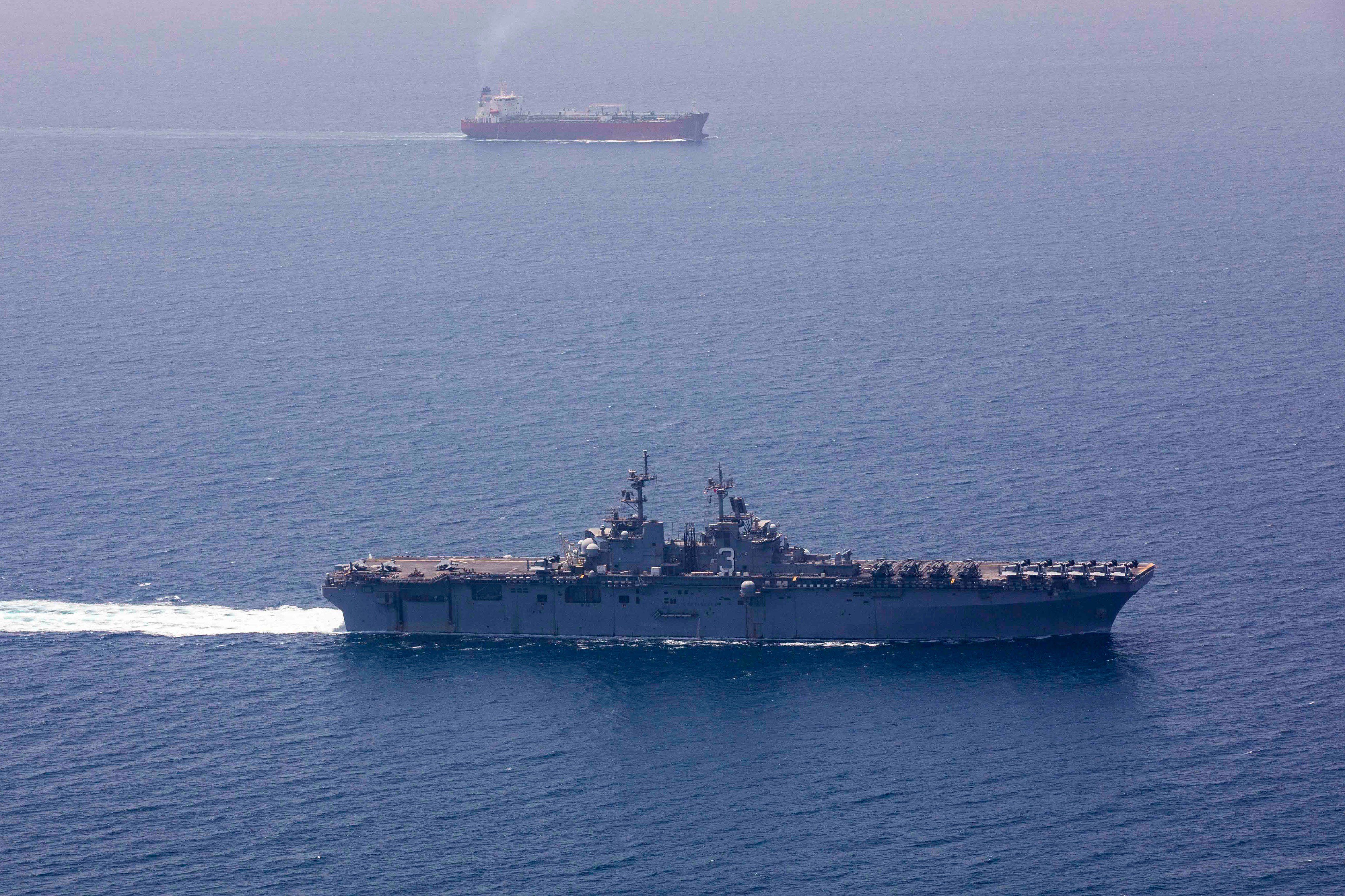 US imposes new Iran sanctions as officials say Hormuz deal is near