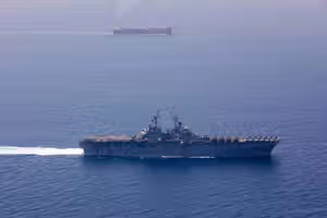 US imposes new Iran sanctions as officials say Hormuz deal is near