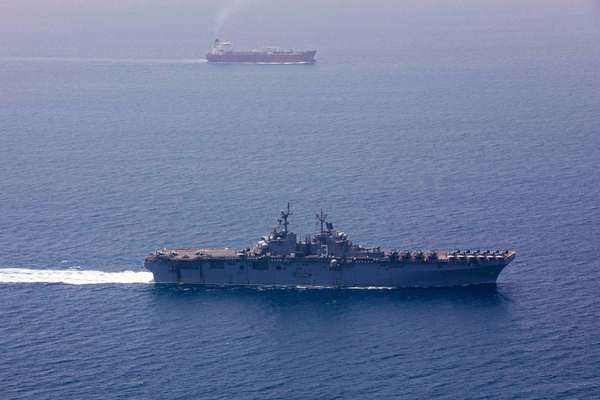 US imposes new Iran sanctions as officials say Hormuz deal is near