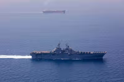 US imposes new Iran sanctions as officials say Hormuz deal is near