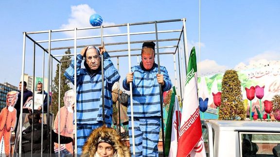 People wearing masks of US President Donald Trump and Israeli Prime Minister Benjamin Netanyahu behind bars during rallies marking the anniversary of the 1979 Islamic Revolution in Iran, February 10, 2024.