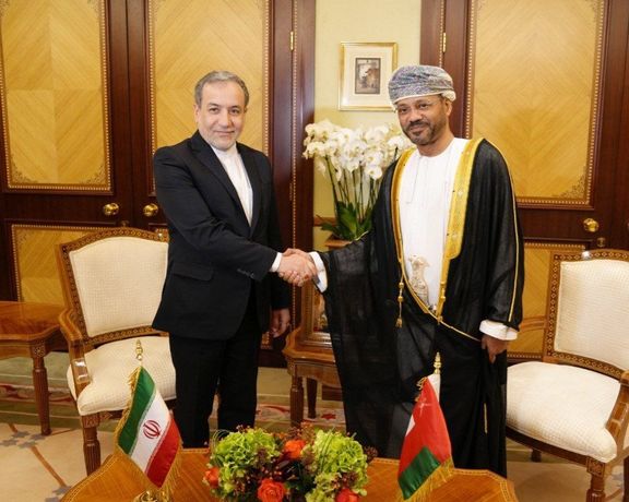 Iranian Foreign Minister Abbas Araghchi (left) and Oman's Foreign Minister Badr al-Busaidi in Muscat on October 14, 2024