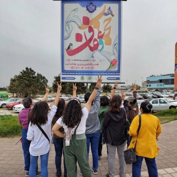 A group of Iranian women unveiling in public in defiance of mandatory hijab