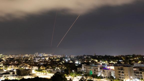 An anti-missile system operates after Iran launched drones and missiles towards Israel, as seen from Ashkelon, Israel April 14, 2024