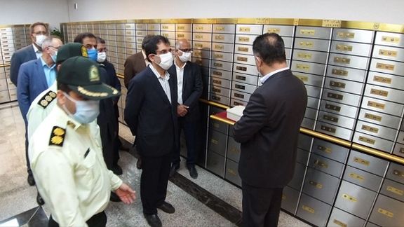 Officials and police inspect a section of safety deposit boxes at Bank Melli. June 6, 2022