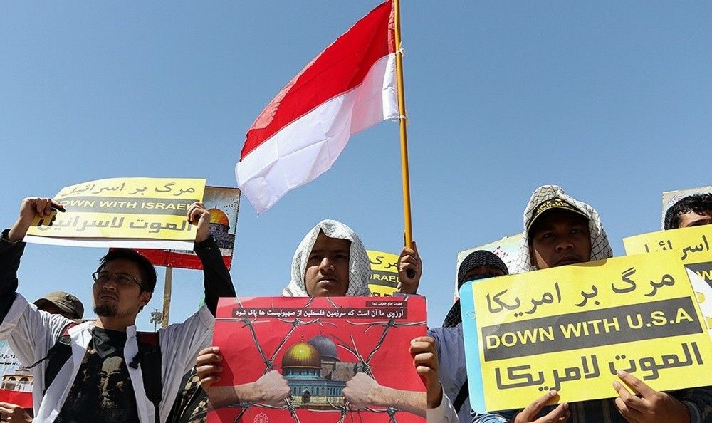 Ali al-Attas attends a government-organized Quds Day march in Qom.