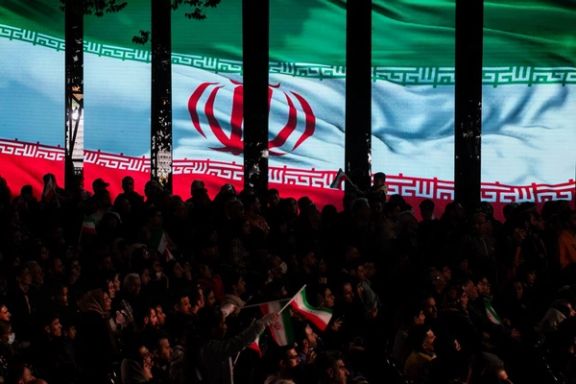 Iran's flag appears on a large screen at a state-sponsored event in Tehran, November 7, 2025