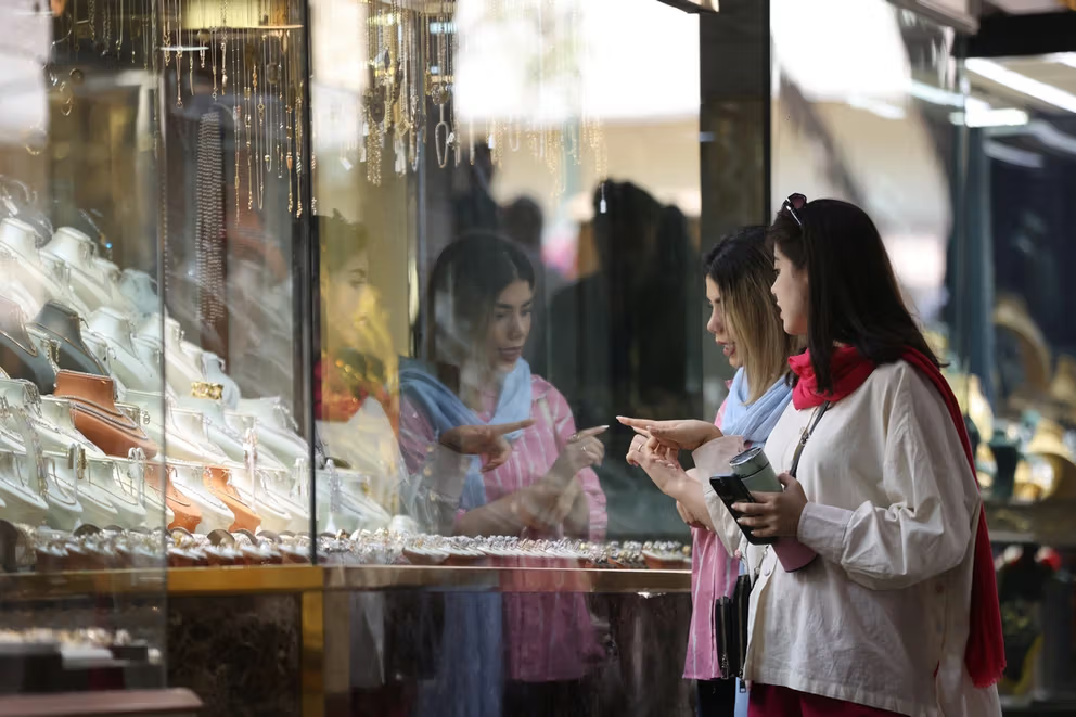 Iranian women look at jewellery displayed in a store in Tehran, Iran, September 27, 2025.