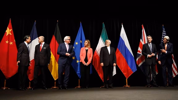 Officials announcing Iran nuclear agreement in Vienna in July 2015. (From left to right) Foreign ministers/secretaries of state Wang Yi (China), Laurent Fabius (France), Frank-Walter Steinmeier (Germany), Federica Mogherini (EU), Mohammad Javad Zarif (Iran), Philip Hammond (UK), John Kerry (USA)