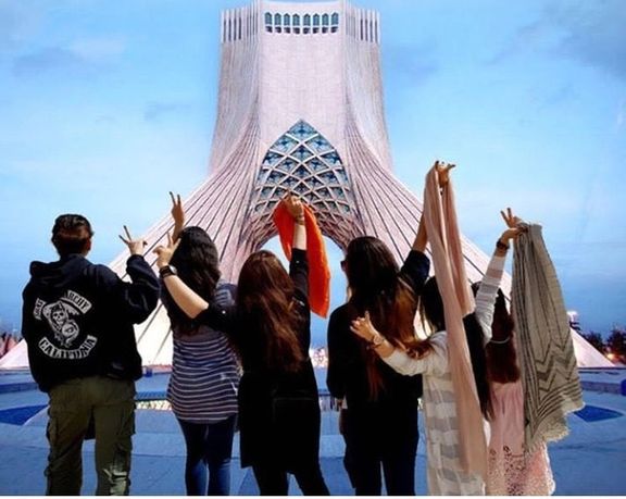 Young Iranian women removing their headscarves