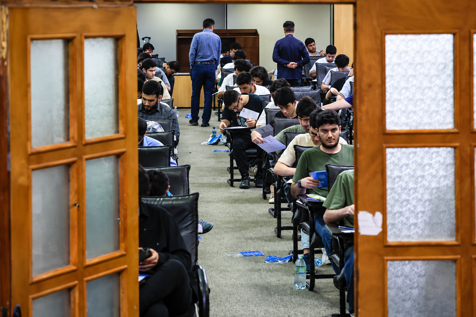 Students take an exam at a testing center in Iran.