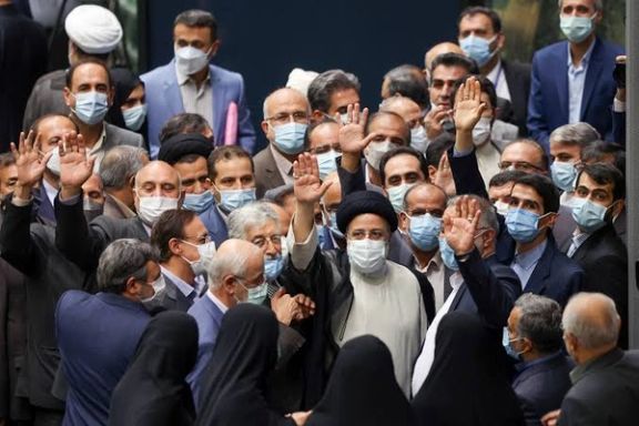 Iran's new President Ebrahim Raisi waves during his swearing-in ceremony at the parliament in Tehran, Iran, August 5, 2021.