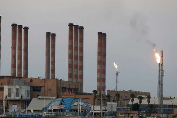 US Hits Firms Over Iran Petro-Exports, Tehran Ups Nuclear Work