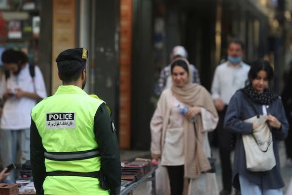 An Iranian police force stands on a street during the revival of morality police in Tehran, Iran, July 16, 2023