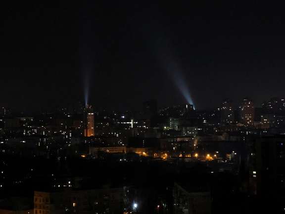 Ukrainian servicemen use searchlights as they search for drones in a sky over city during a Russian drones strike, amid Russia's attack on Ukraine, in Kyiv, January 1, 2023.