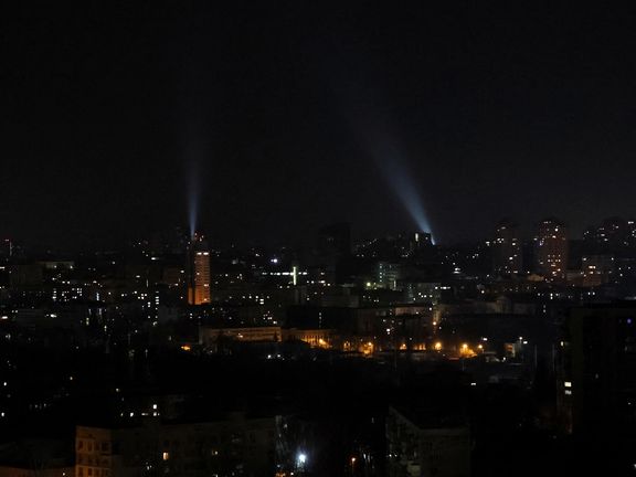 Ukrainian servicemen use searchlights as they search for drones in a sky over city during a Russian drones strike, amid Russia's attack on Ukraine, in Kyiv, January 1, 2023.