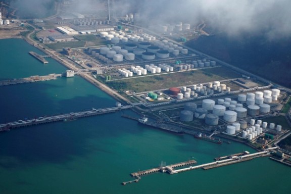 Oil and gas tanks are seen at an oil warehouse at a port in Zhuhai, China October 22, 2018.