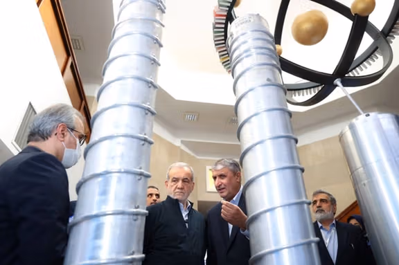 Iran's president Masoud Pezeshkian visiting a nuclear facility, accompanied by atomic agency chief Mohammad Eslami, Spring 2025