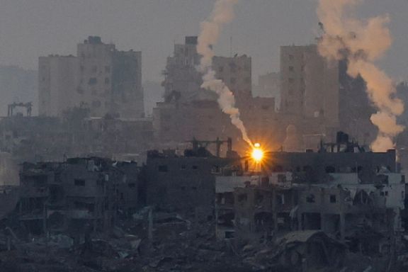A flare burns above Gaza, as seen from southern Israel, amid the ongoing conflict between Israel and the Palestinian group Hamas, November 14, 2023.