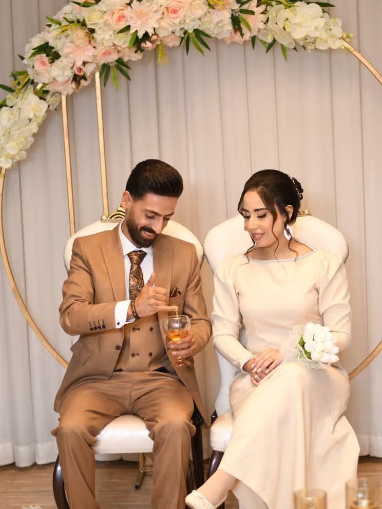 Meysam Ghaderi and his wife on their wedding day. Ghaderi was shot dead during protests in Karaj on January 8, just seven days after the couple married following an 11-year relationship.