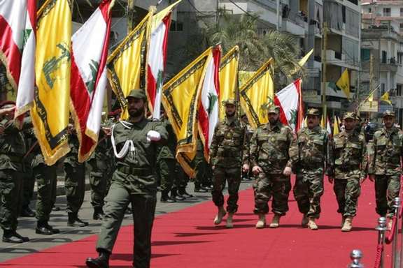 Hezbollah militia members marching in Beirut Lebanon. FILE PHOTO