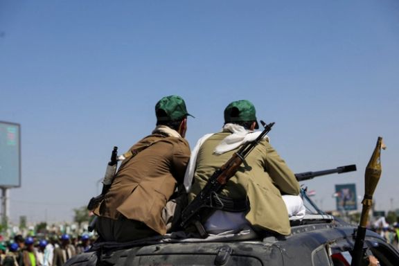 Houthi-mobilized fighters ride atop a car in Sanaa, Yemen September 21, 2024.