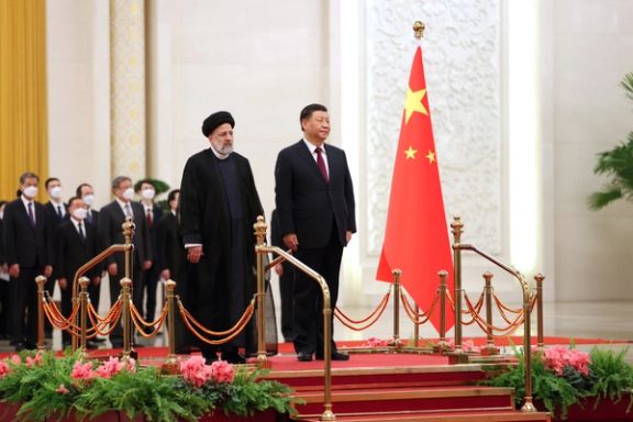 Iranian President Ebrahim Raisi stands next to Chinese President Xi Jinping during a welcoming ceremony in Beijing, China, February 14, 2023.