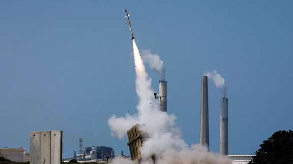 An Iron Dome anti-missile system fires an interceptor missile as a rocket is launched from the Gaza Strip towards Israel, August 7, 2022