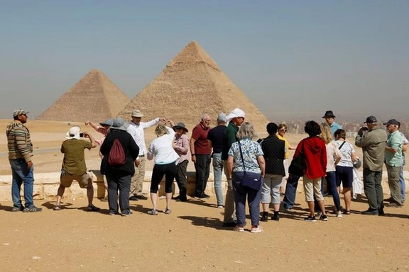 Tourists gather at the Great Pyramids of Giza, on the outskirts of Cairo, Egypt March 8, 2020.