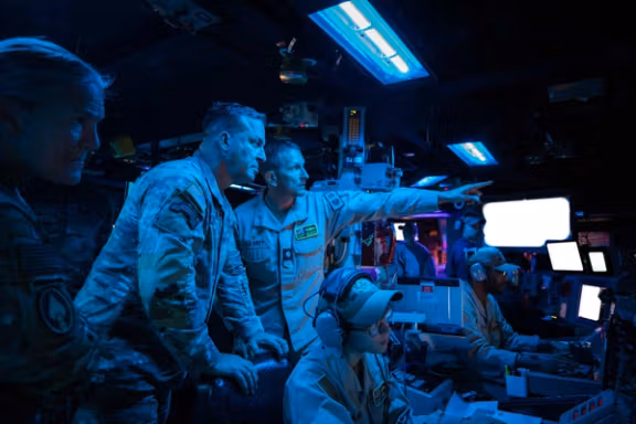 US Central Command (CENTCOM) chief Army General Michael Kurilla (second from left) meets with military personnel