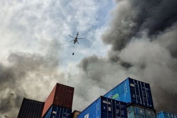 A helicopter extinguishes fire following an explosion at the Shahid Rajaee port in Bandar Abbas, Iran, April 27, 2025.